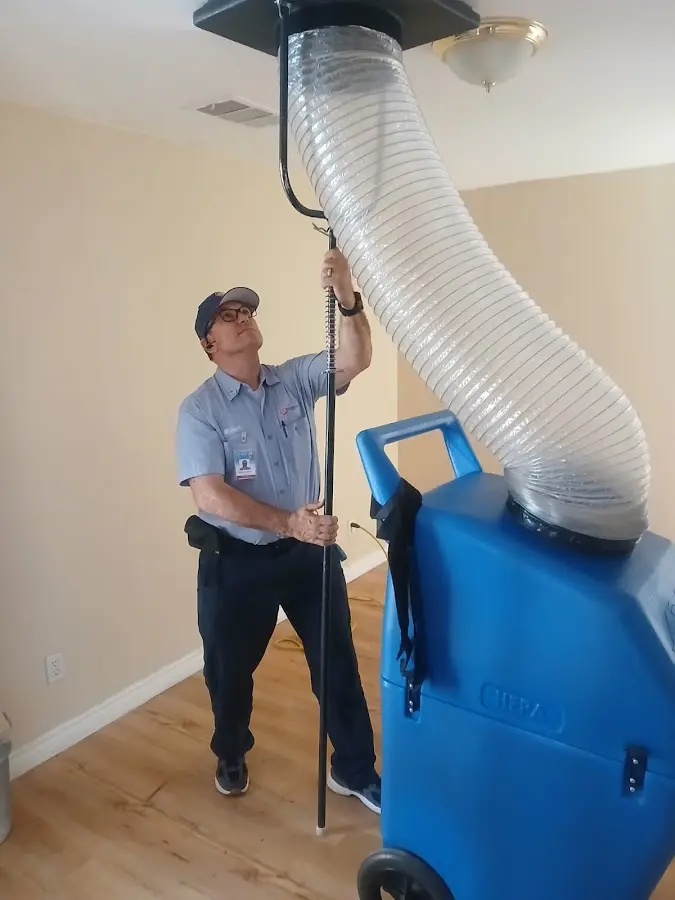 Furnace Tune-Up technician using HEPA equipment in Prattville
